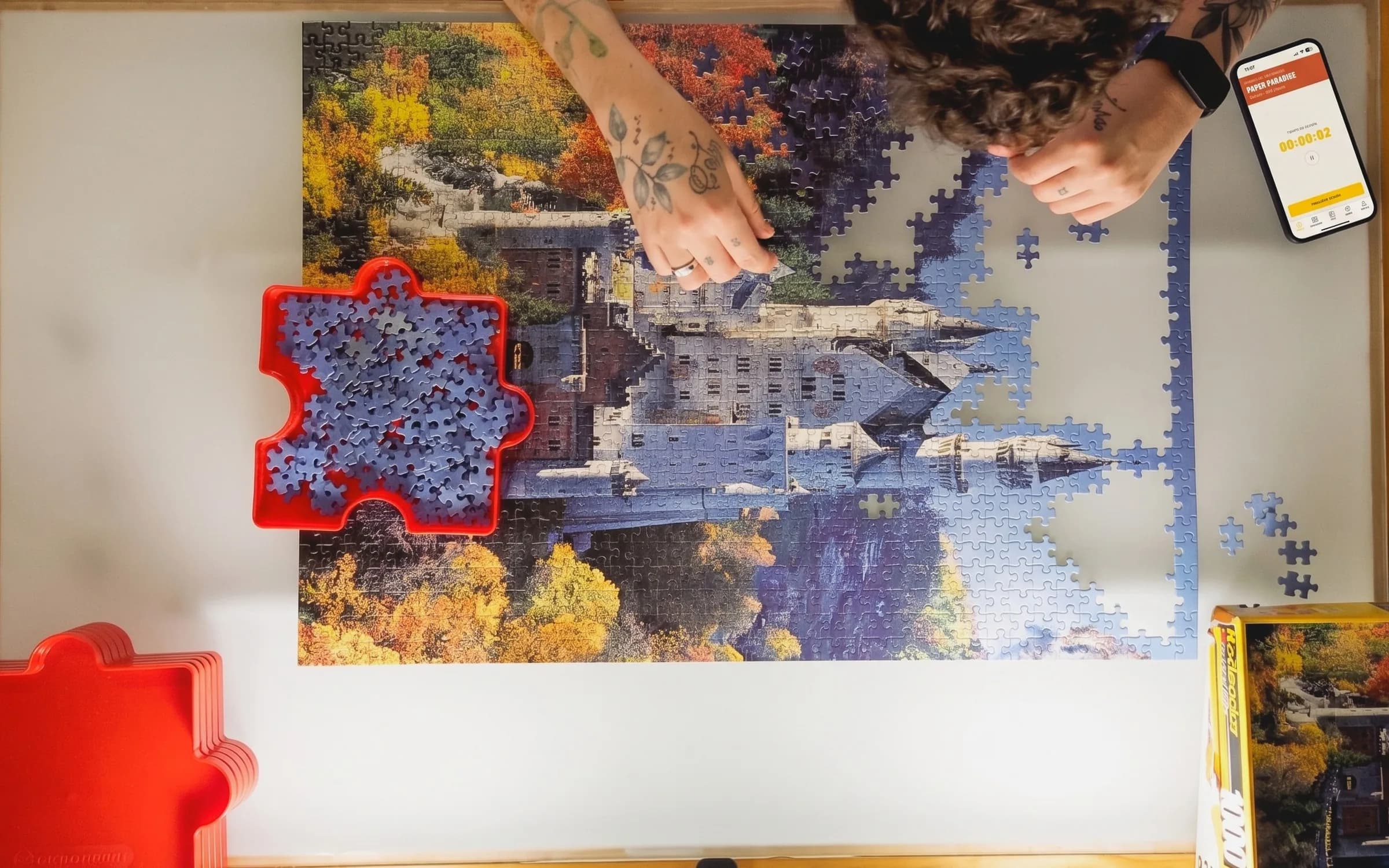 The cell phone next to the puzzle, with the Puzzlr timer running